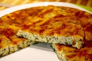 Cheesecake with greens in a pan