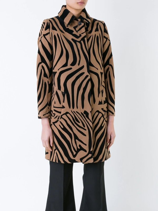 Girl in a coat with a zebra print