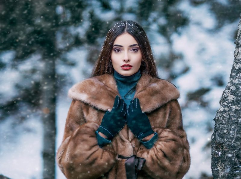 Fashionable images with a fur coat Girl in a fur coat