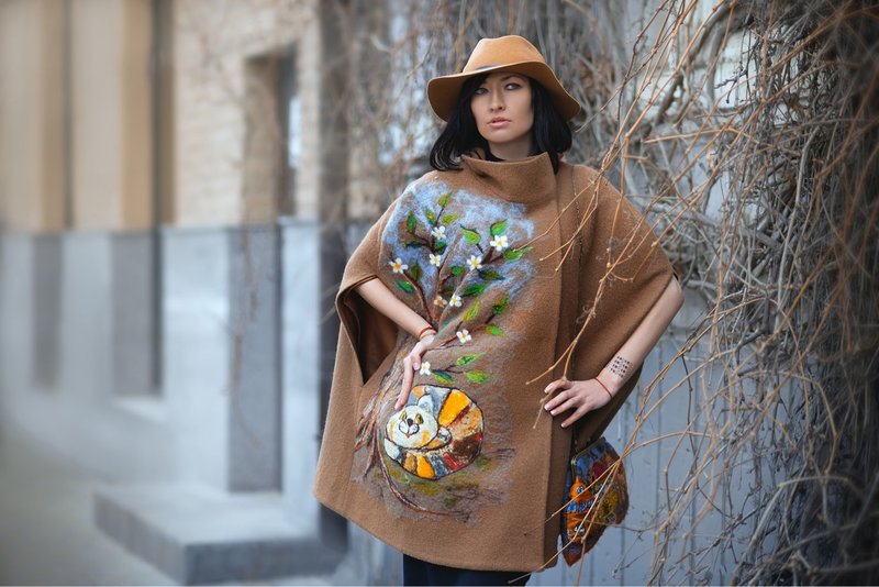 Girl in a cape coat with an interesting print