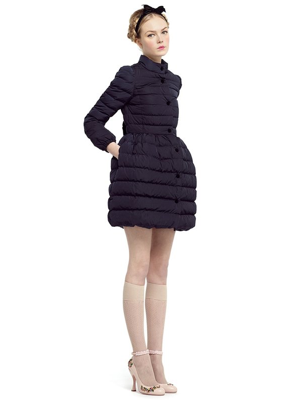 Girl in a quilted coat with a bell skirt