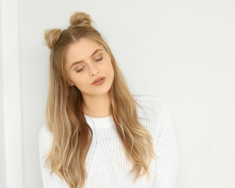 A girl with two bunches combined with her hair