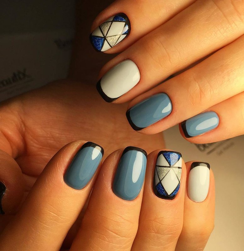 Geometric design with jacket on nails with gel polish. Geometric design on nails with gel polish.