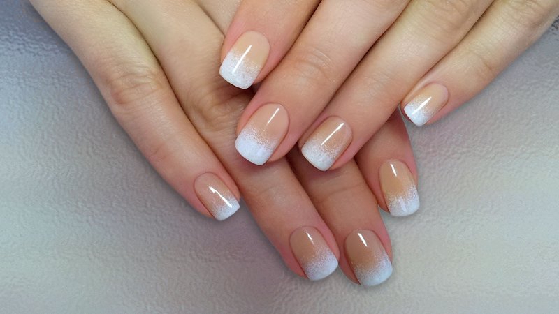 Light gradient in french manicure with gel polish Light gradient in french manicure with gel polish