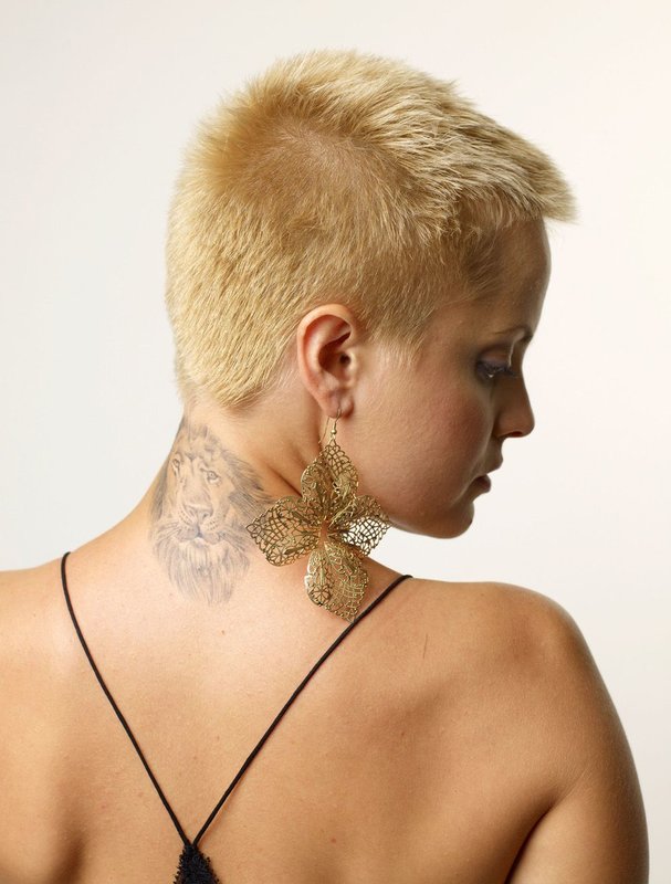 Girl with a haircut hedgehog: rear view