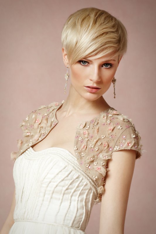 Girl with a pixie haircut and an extended oblique bang