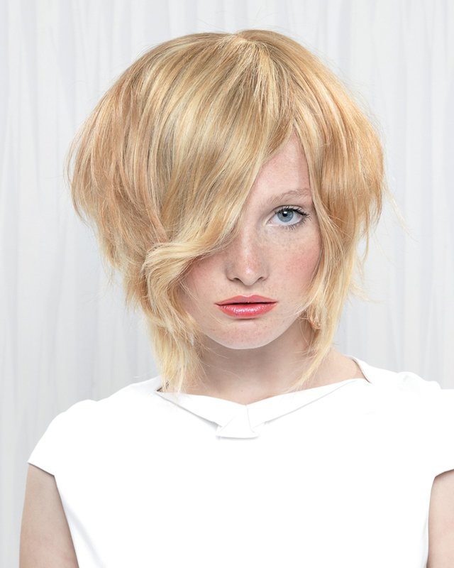 Girl with a bob-haircut and long oblique bangs