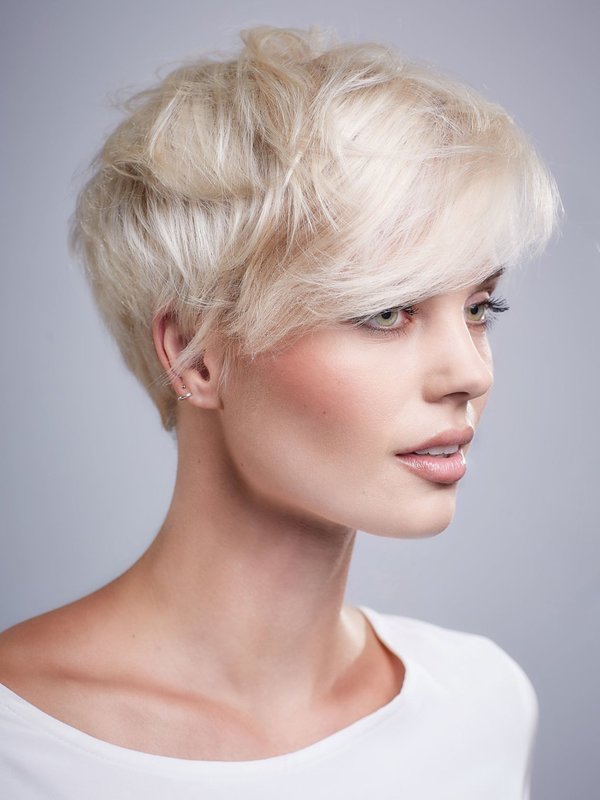 Girl with a pixie haircut and a slanting bang