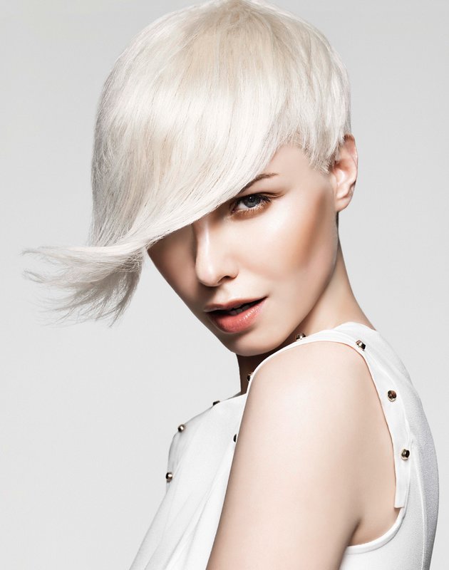 A girl with an asymmetric pixie haircut and a long oblique bang