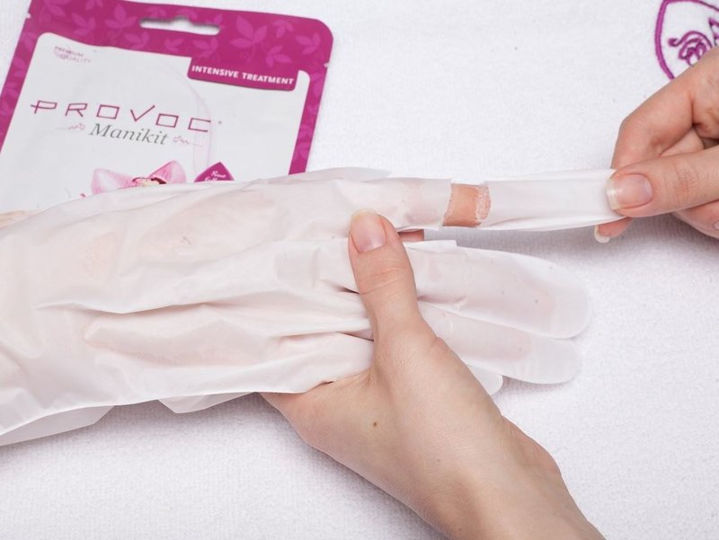 Hands in gloves with cream Hands in gloves with cream