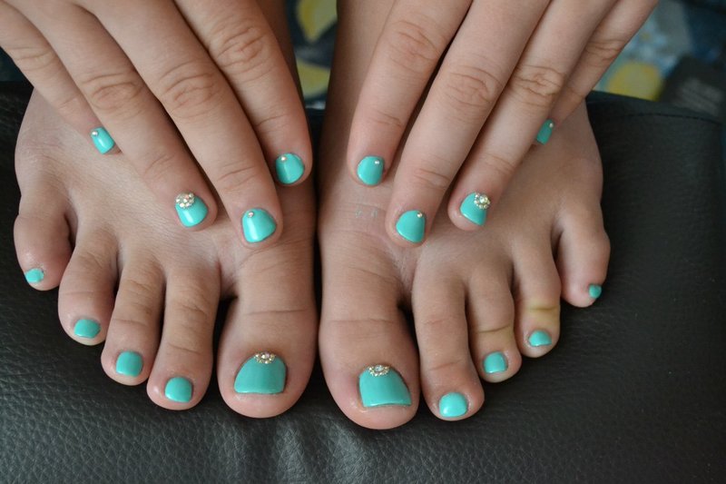 Turquoise pedicure with rhinestones Turquoise pedicure with rhinestones
