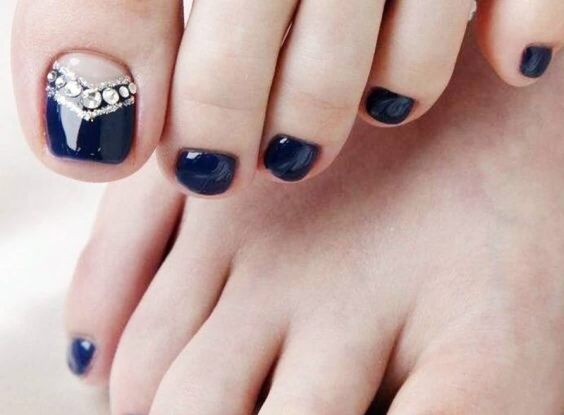 Dark blue pedicure with rhinestones Dark blue pedicure with rhinestones