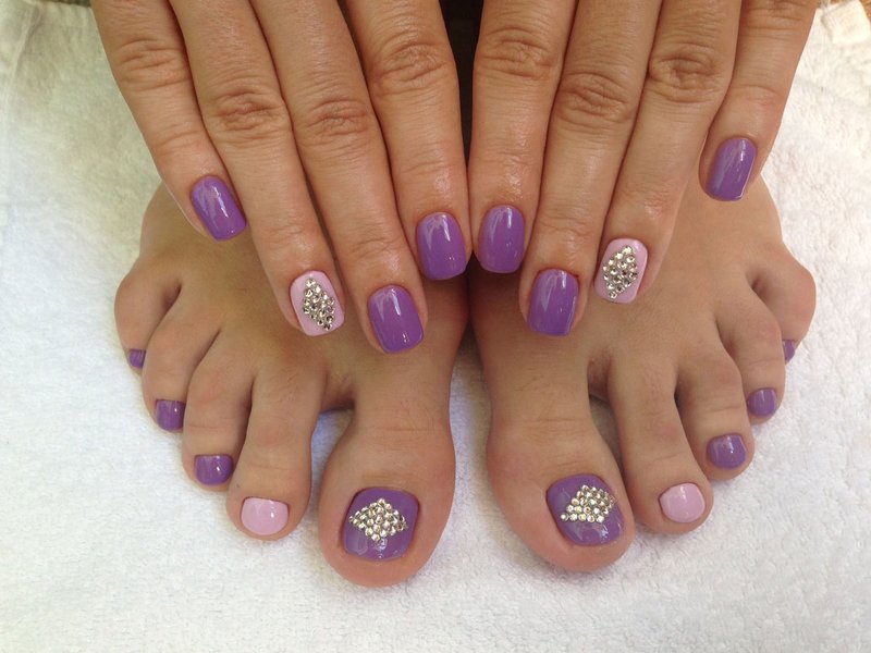 Minimalist purple pedicure with rhinestones. Purple with rhinestones