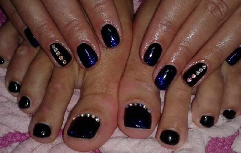 Black pedicure with rhinestones Black pedicure with rhinestones