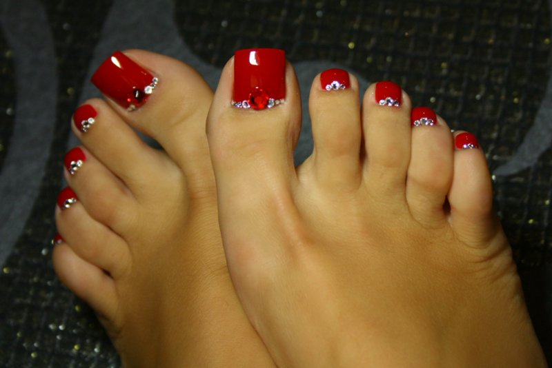 Red pedicure with rhinestones Red pedicure with rhinestones
