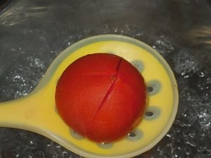 Salted tomatoes with garlic and herbs