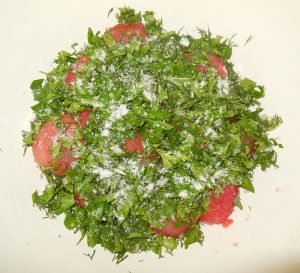 Salted tomatoes with garlic and herbs