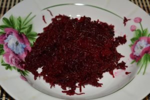 Beetroot salad with nuts, garlic and wheat seedlings