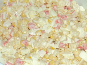 Salad of crab sticks and pineapple