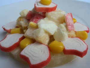 Salad of crab sticks and pineapple
