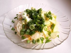 Sauerkraut salad with apple and green onions