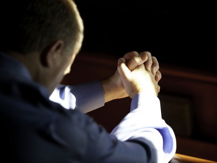A man prays for strengthening the family