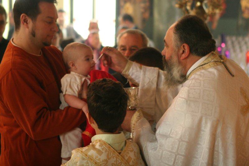 Communion of the baby in the church