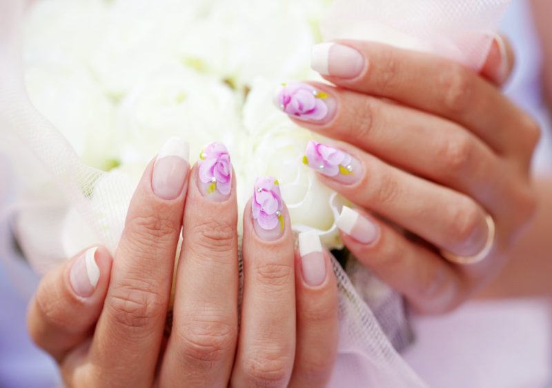 Wedding manicure with bright colors.