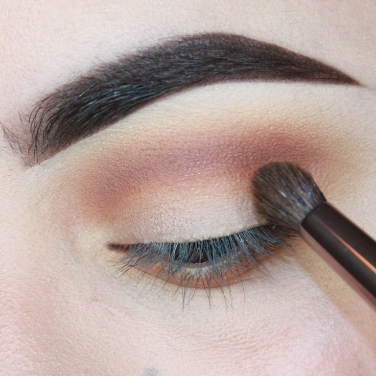 Adding dark shadows to the crease of the eyelid