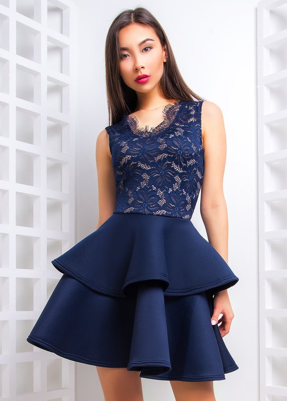 Girl in a short cocktail dress with lace top Girl in a short cocktail dress with lace top