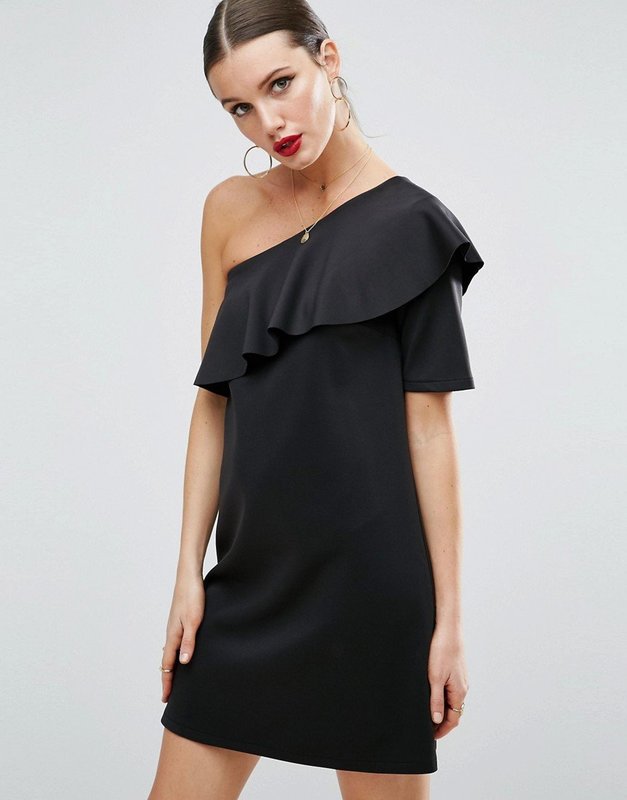 Girl in a cocktail dress with a short asymmetric sleeve Girl in a cocktail dress with a short asymmetric sleeve