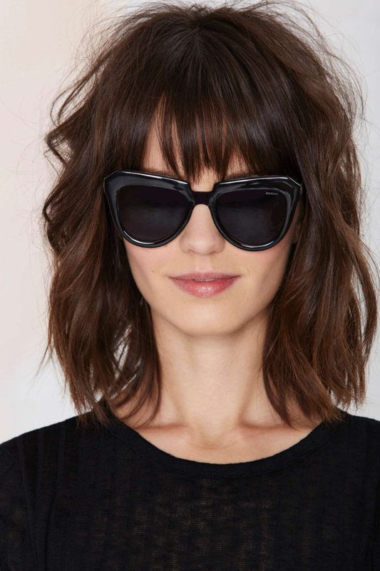 Girl with graduated bangs with torn fringing