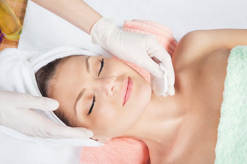 At a beautician appointment The essence of facial cleansing by a cosmetologist