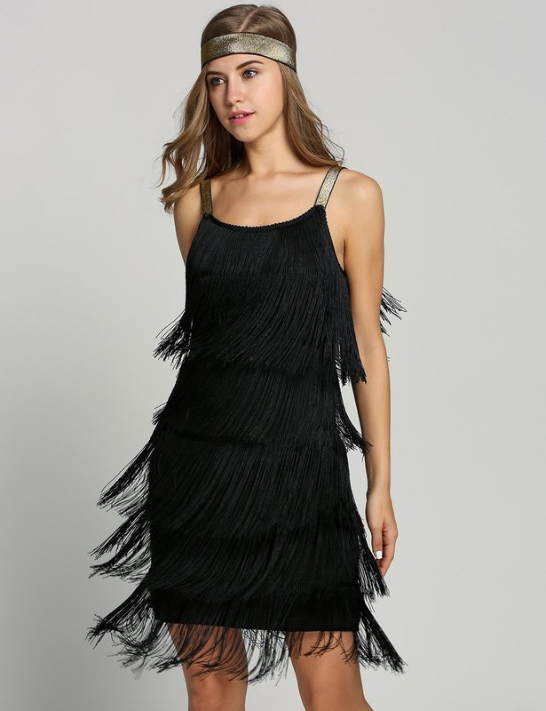 Girl in a cocktail dress with a fringe along the entire length of the dress Girl in a cocktail dress with a fringe along the entire length of the dress