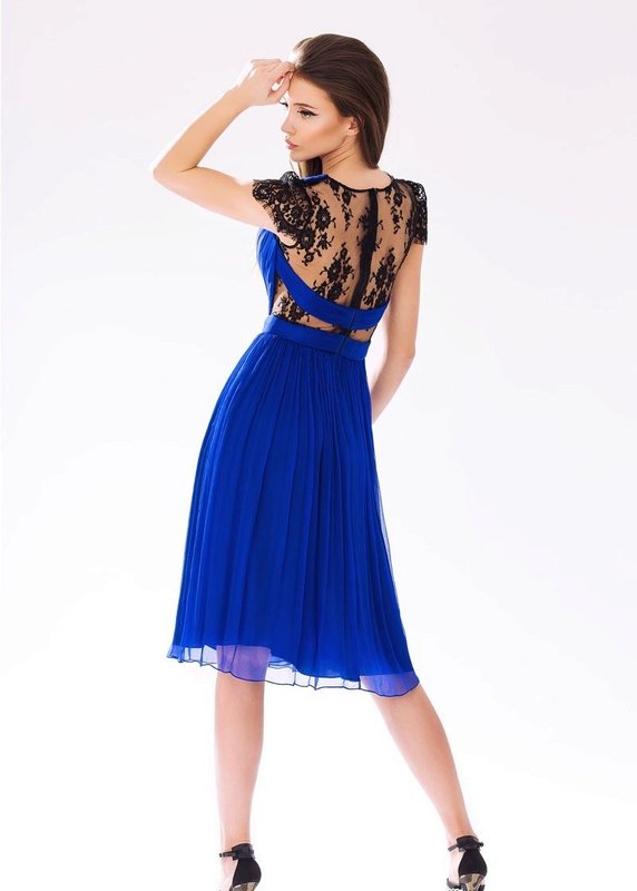 Girl in a blue cocktail dress with lace on her back Girl in a blue cocktail dress with lace on her back