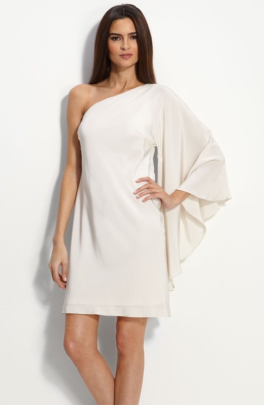 Girl in a cocktail dress with one shoulder sleeve Girl in a cocktail dress with one shoulder sleeve