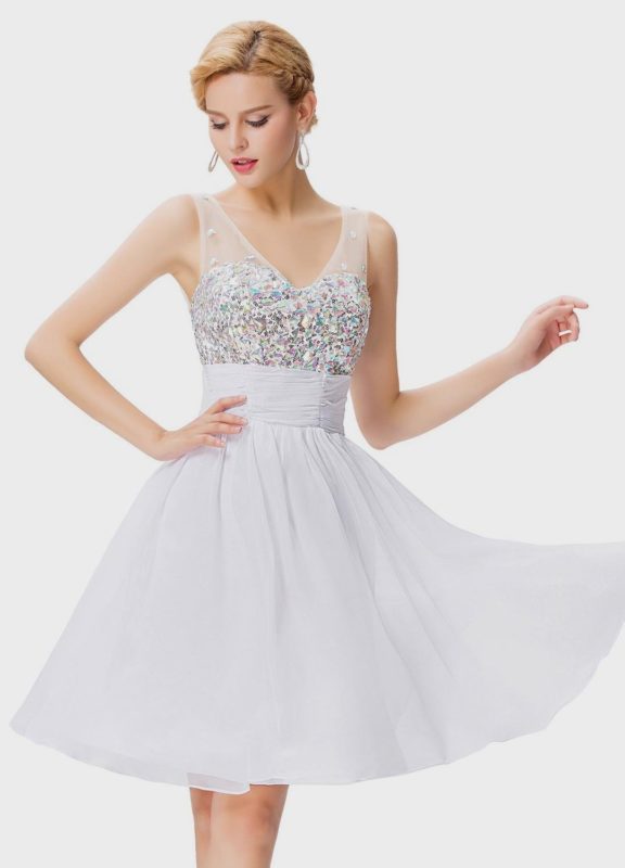 Girl in a white cocktail dress with a sparkling bodice Girl in a white cocktail dress with a sparkling bodice