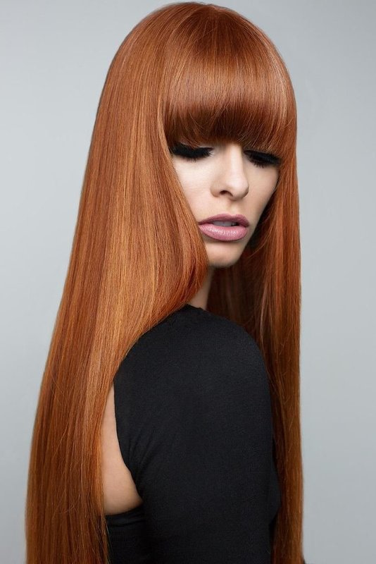 Girl with a long straight bang and a straight haircut