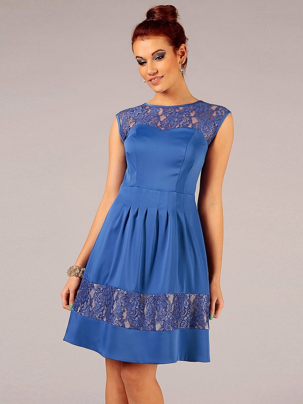 Girl in a blue cocktail dress with lace accents Girl in a blue cocktail dress with lace accents