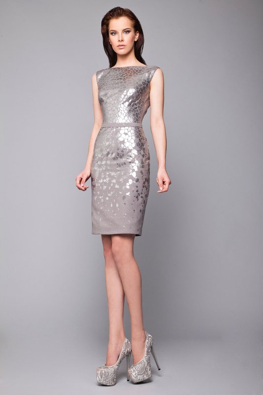 Girl in a gray cocktail sheath dress with a boat neckline Girl in a gray cocktail sheath dress with a boat neckline