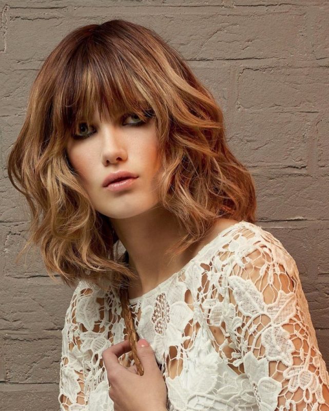 Girl with a cascade and graduated bangs