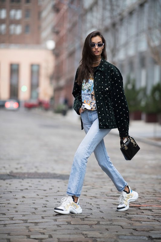 A girl in bulky sneakers combined with jeans