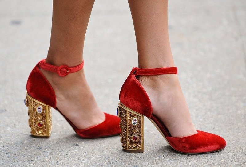 Red shoes with a strap and an unusual heel Red shoes with a strap and an unusual heel