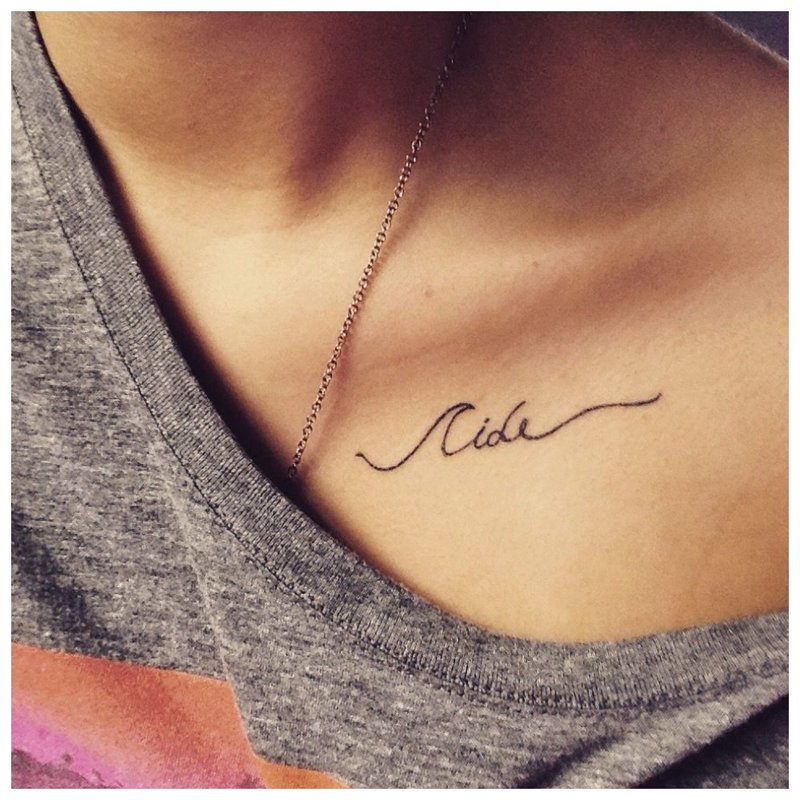 Lettering under the collarbone - beautiful tattoo